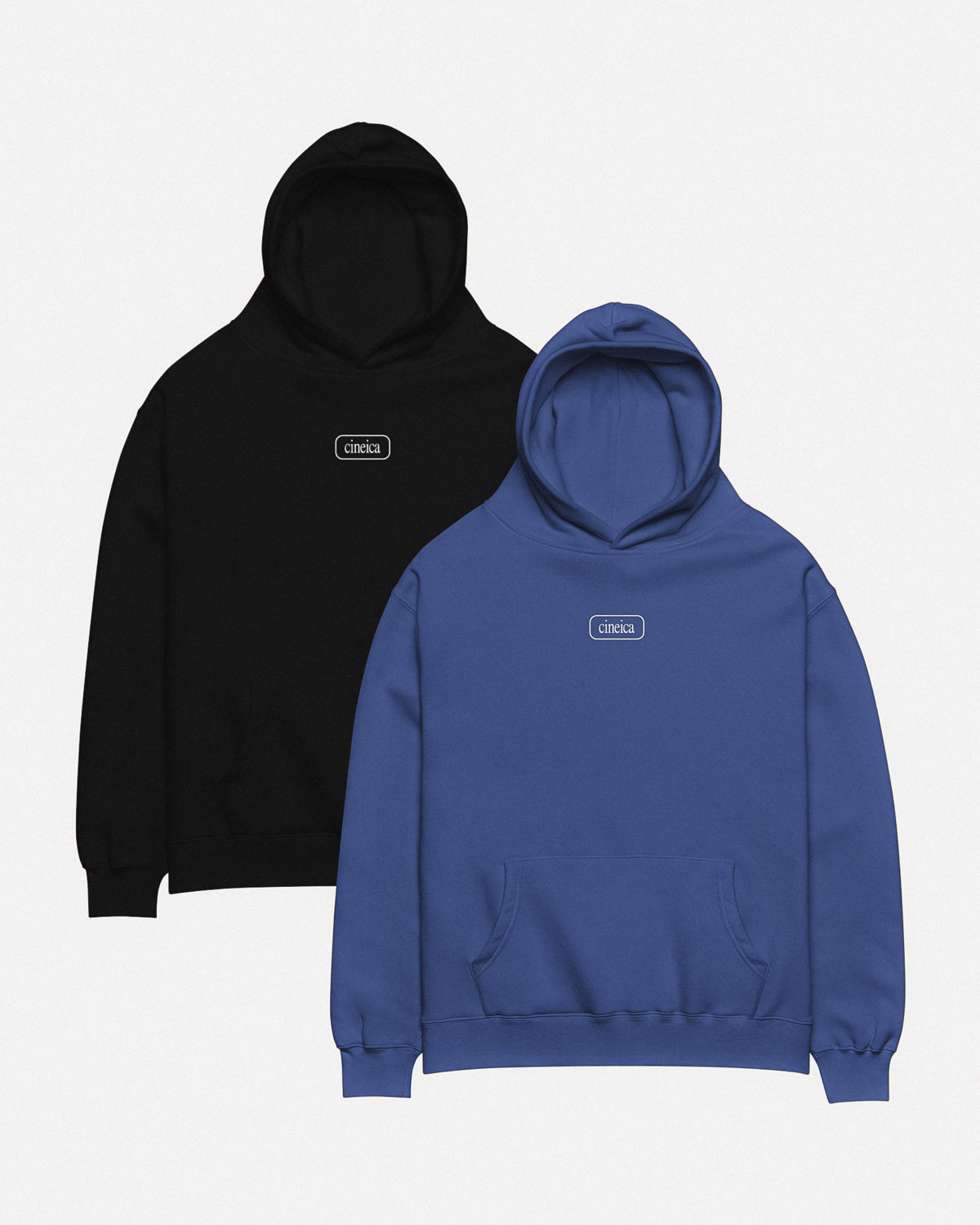 Photo of the fronts of two cineica hoodies. One is black and one is blue. Both feature a framed cineica logo centered on the chest.