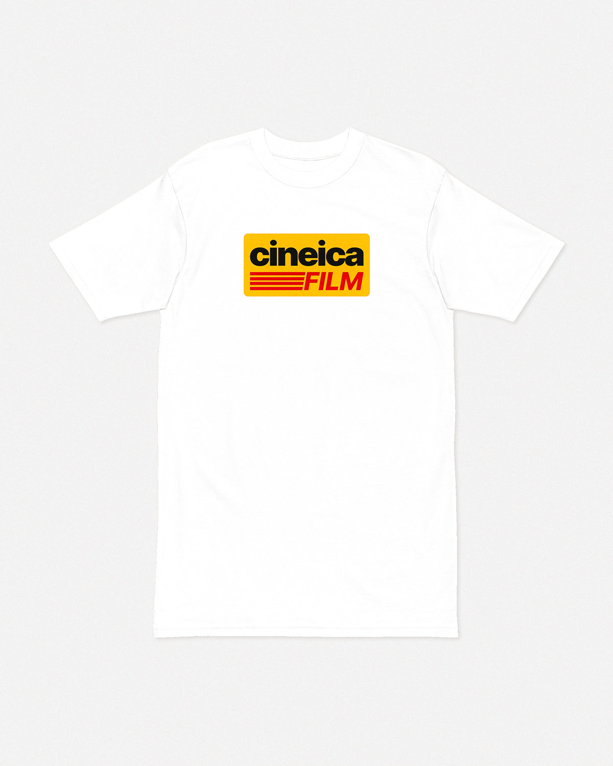 Photo of a white t-shirt with a vintage yellow graphic and text "cineica film" in a Kodak style.