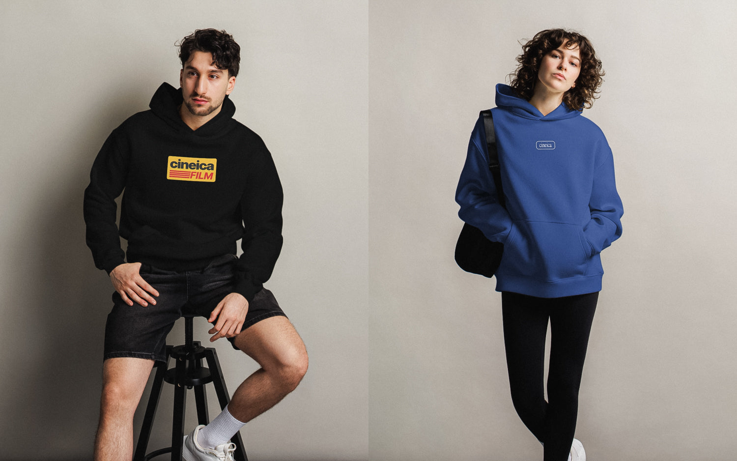 Photo of a man and woman wearing cineica hoodies. The man is wearing a black "Cineica Film Hoodie" and the woman is wearing a blue "Blueprint Hoodie".