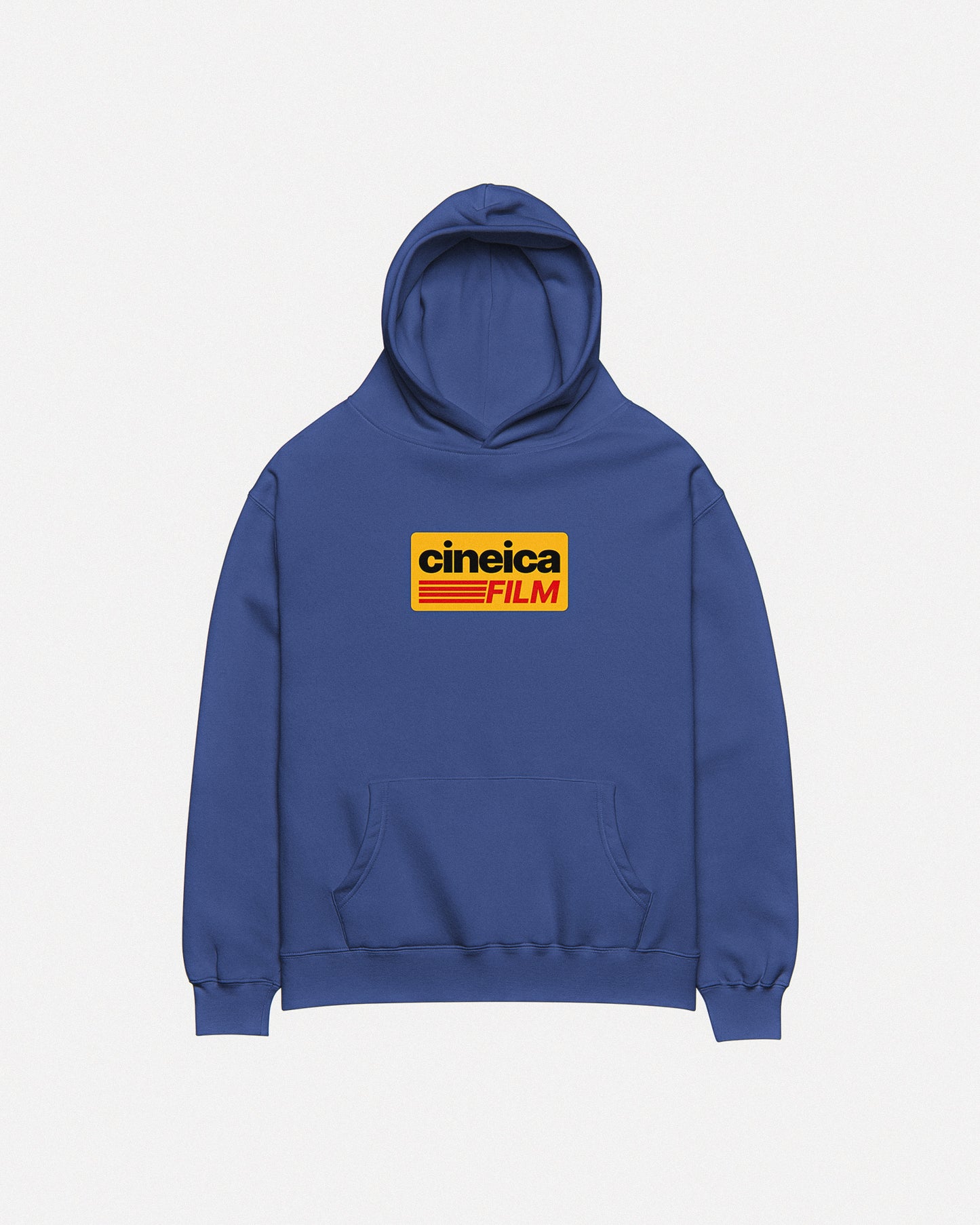 Photo of a blue cineica hoodie front. The design features a yellow graphic with black and red text in a vintage style, the text states "cineica FILM".