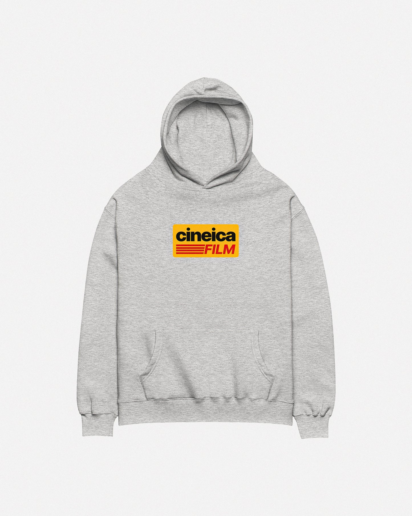 Photo of a gray cineica hoodie front. The design features a yellow graphic with black and red text in a vintage style, the text states "cineica FILM".