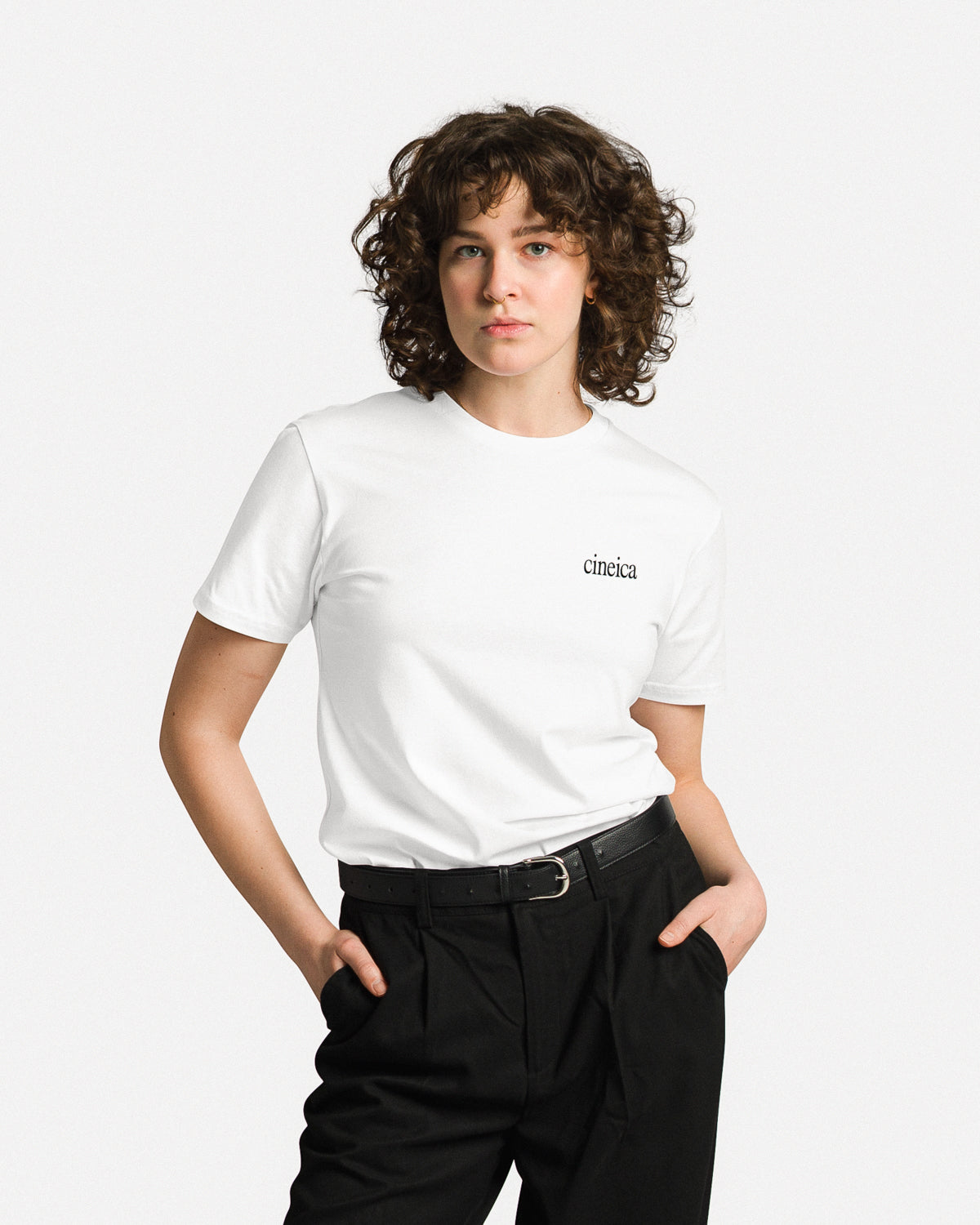 Photo of a man in a white t-shirt with a black cineica logo.