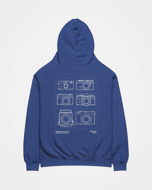 Back of a blue hoodie with white design featuring six film cameras in a blueprint style.