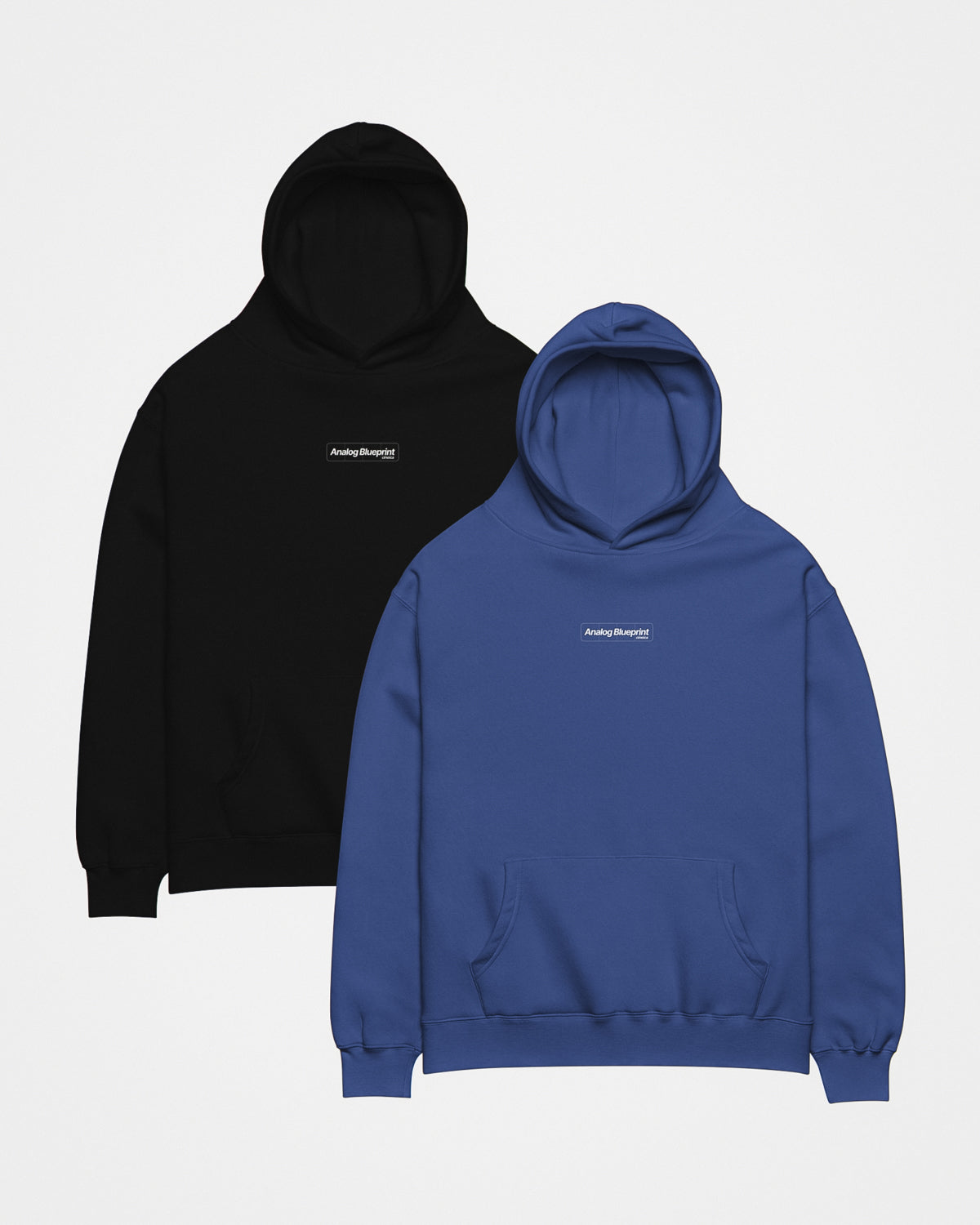 Fronts of a blue and black hoodie with a white design featuring the text "Analog Blueprint", "cineica" centered on the chest.