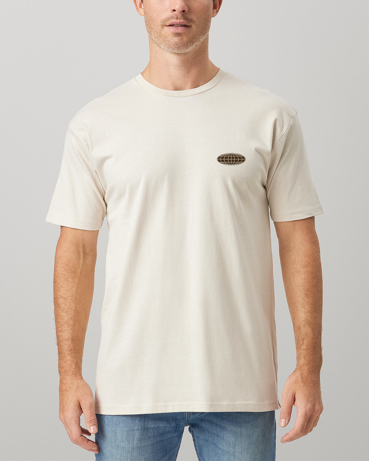 Man wearing a natural beige t-shirt front with minimal design.