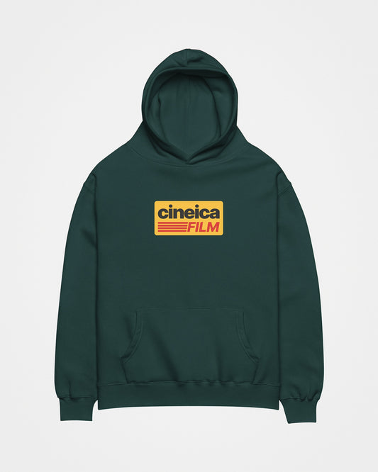 Front of a green relaxed hoodie with a vintage retro design with Kodak Film colors and the text "cineica film".